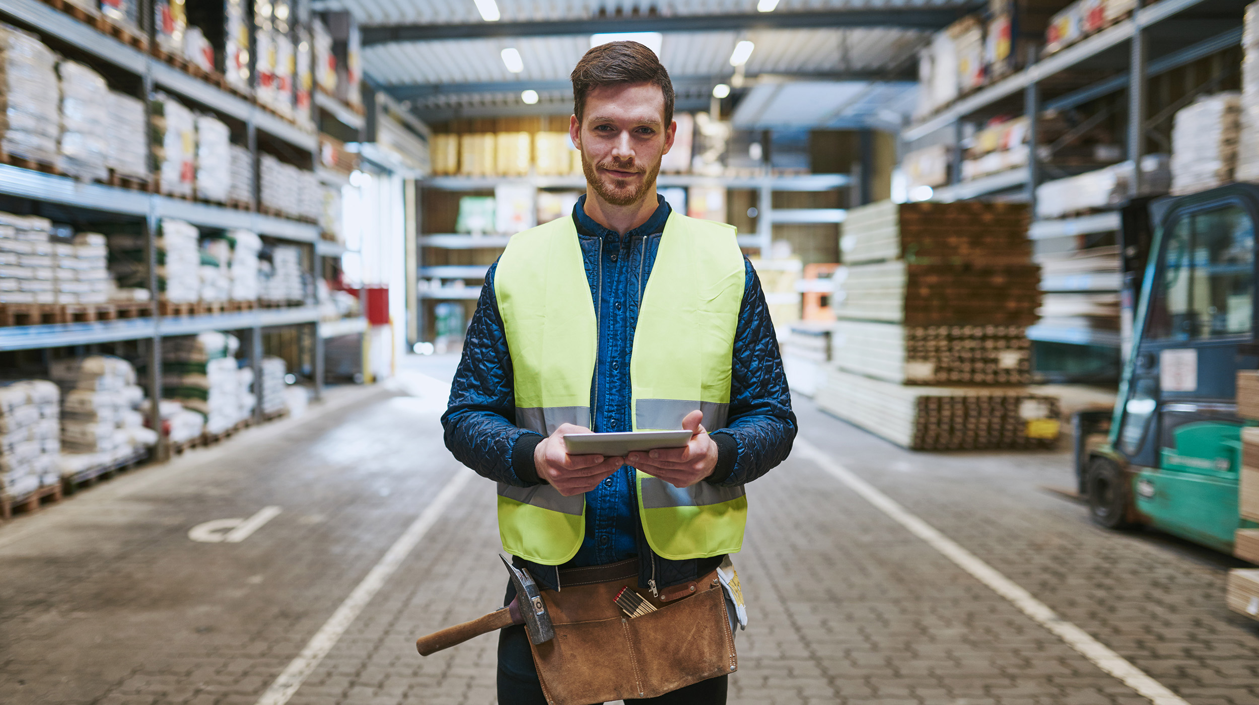 man standing in wearhouse